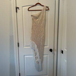 White sequin prom dress with fringe on the side.
